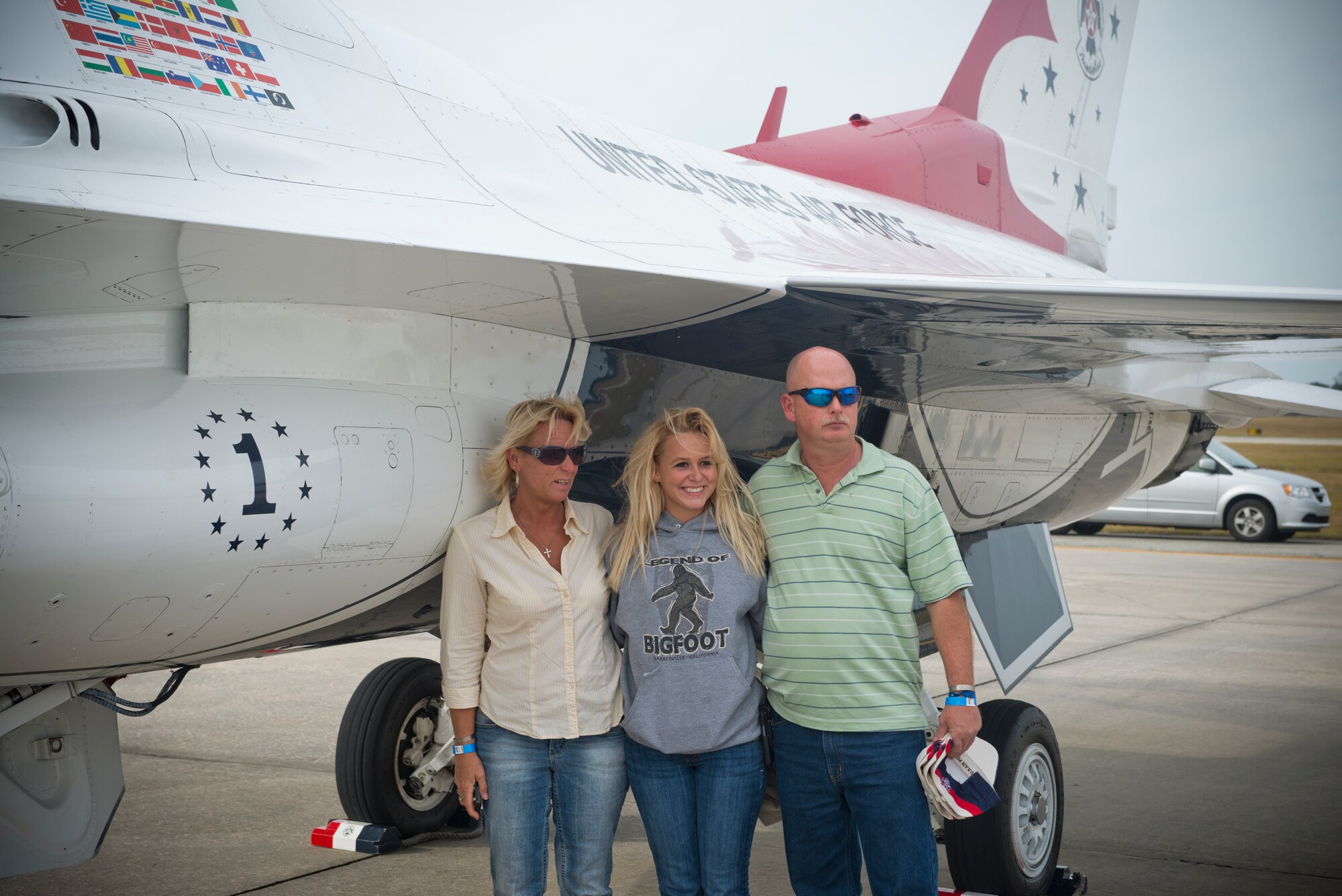 Family members of fallen warrior U.S. Air Force Senior Airman Michael J. Buras, pose next to an F-16 Thunderbird Fighting Falcon during the Moody Air Force Base, Ga., Legacy of Liberty Open House air show Oct. 27, 2012. Thunderbird No. 1 was flown in memory of Buras who died in Kandahar, Afghanistan, Sept. 21, 2010.  (U.S. Air Force photo by Senior Airman Douglas Ellis/Released)
