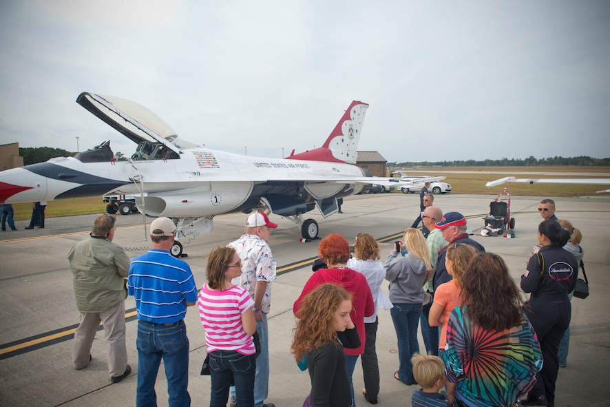 The family of fallen warrior U.S. Air Force Senior Airman Michael J. Buras, observes an F-16 Thunderbird Fighting Falcon during the Moody Air Force Base, Ga., Legacy of Liberty Open House air show Oct. 27, 2012. The family also had a chance to meet and speak with Airmen from the U.S. Air Force Thunderbirds Flight Demonstration Team. (U.S. Air Force photo by Senior Airman Douglas Ellis/Released)
