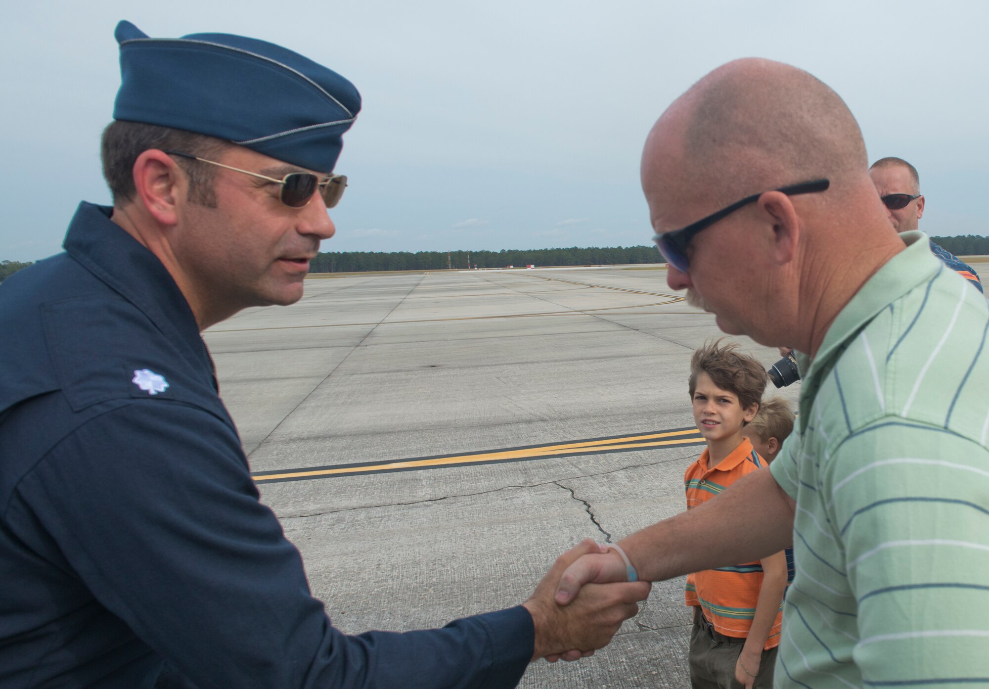 John Buras, father of fallen warrior U.S. Air Force Senior Airman Michael J. Buras, shakes hands with Lt. Col. Greg Moseley, U.S. Air Force Air Demonstration Squadron “Thunderbirds” commander, during the Moody Air Force Base, Ga., Legacy of Liberty Open House air show Oct. 27, 2012. Michael Buras was killed in Kandahar, Afghanistan, by an improvised explosive device on Sept. 21, 2010. (U.S. Air Force photo by Senior Airman Douglas Ellis/Released)
