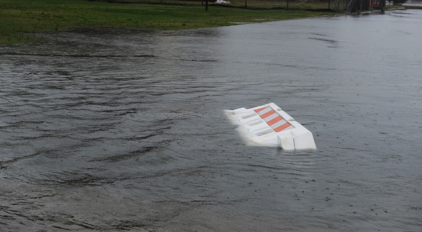 A plastic barrier floats down Bowen Street at Langley Air Force Base, Va., Oct. 29, 2012. Hurricane Sandy, a category one storm, caused extensive flooding but minimal physical damage to base facilities. (U.S. Air Force photo by Airman 1st Class Teresa Aber/Released)