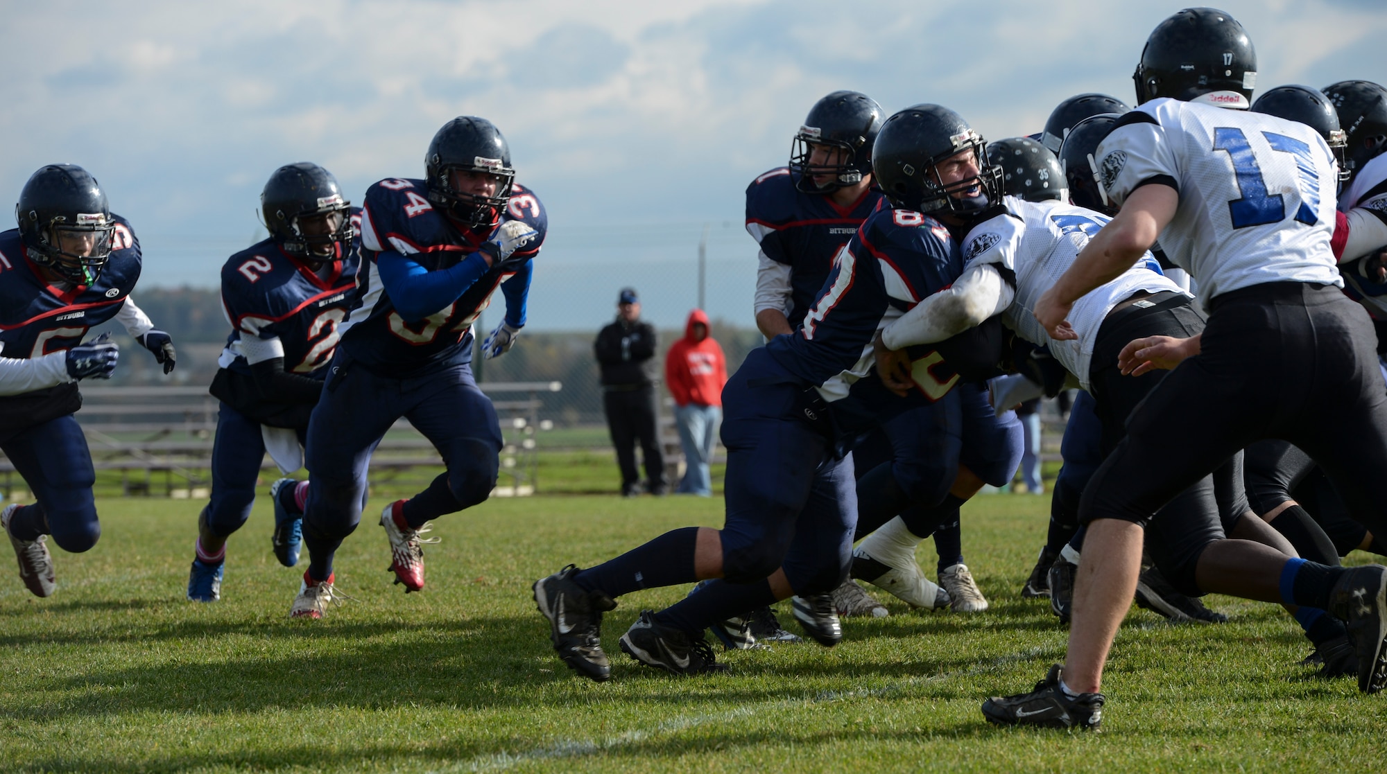 BITBURG ANNEX, Germany -- Bitburg Barons rush the line against Hohenfels Tigers during the Barons' last home game Oct. 27, 2012, at the Rik Carr Field. The undefeated Barons won 56-14. The Barons play in the Division-II championship game, which will be streamed live by American Forces Network 2:30 p.m., Nov. 3, 2012. (U.S. Air Force photo by Senior Airman Natasha Stannard/Released)