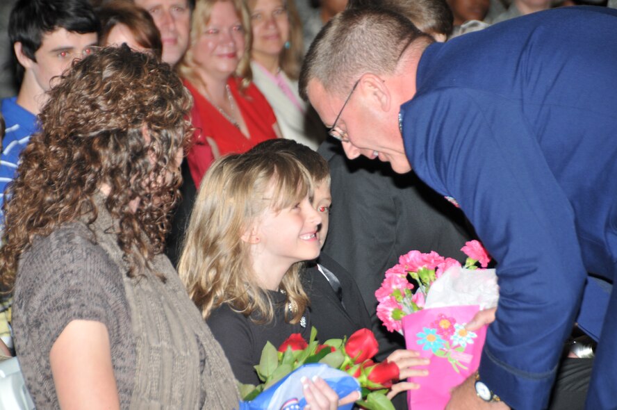 After accepting command for the 145th Airlift Wing during an Assumption of Command ceremony, Col. Roger E. Williams, Jr., thanks his wife Jena Williams for her continuous support, along with their daughter Danielle and sons Dane and Ryan, Col Williams’ father, Roger E. Williams, Sr., his mother Lizzie and his sisters Ann and Peggy along with Peggy’s husband Eddie and their sons Blayne and Hunter.  (National Guard photo by Tech. Sgt. Rich Kerner, 145th Public Affairs)