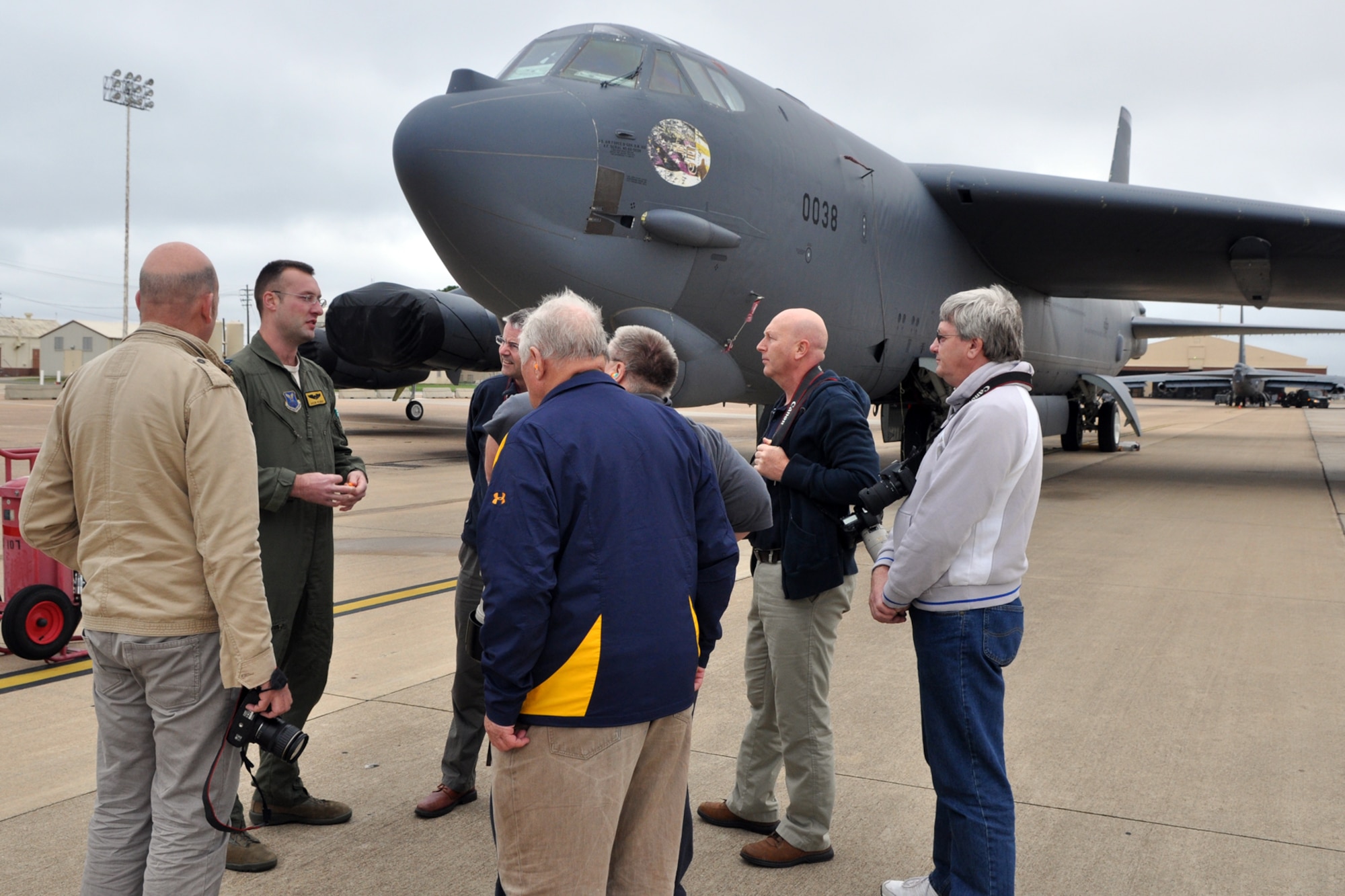 U.S. Air Force Capt. Jacob Wilwert, who is and instructor pilot assigned to the 11th Bomb Squadron answers questions from a group of British visitors at Barksdale Air Force Base, La., Oct. 26, 2012. The men are members of the RAF Fairford Aviation Society in England. They will also attend the “Wings Over Houston Air Show” at the Ellington Airport during their visit to the United States. (U.S. Air Force photo by Master Sgt. Jeff Walston)