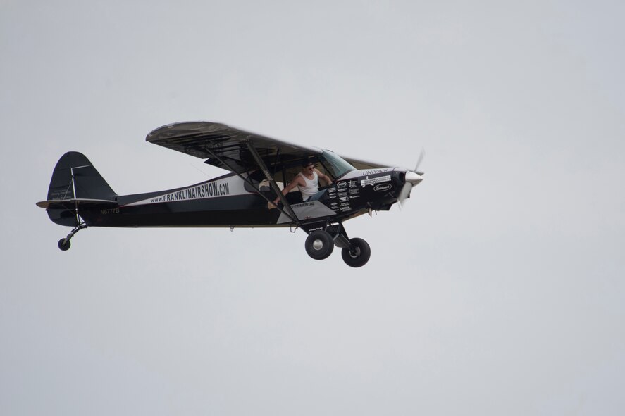 Kyle Franklin, in his PA-18A Super Cub, performs during the Moody Air Force Base, Ga., Legacy of Liberty Open House air show Oct. 27, 2012. Franklin is a third generation pilot and second generation air show performer who learned how to fly at age 8. (U.S. Air Force photo by Staff Sgt. Jamal D. Sutter/Released) 