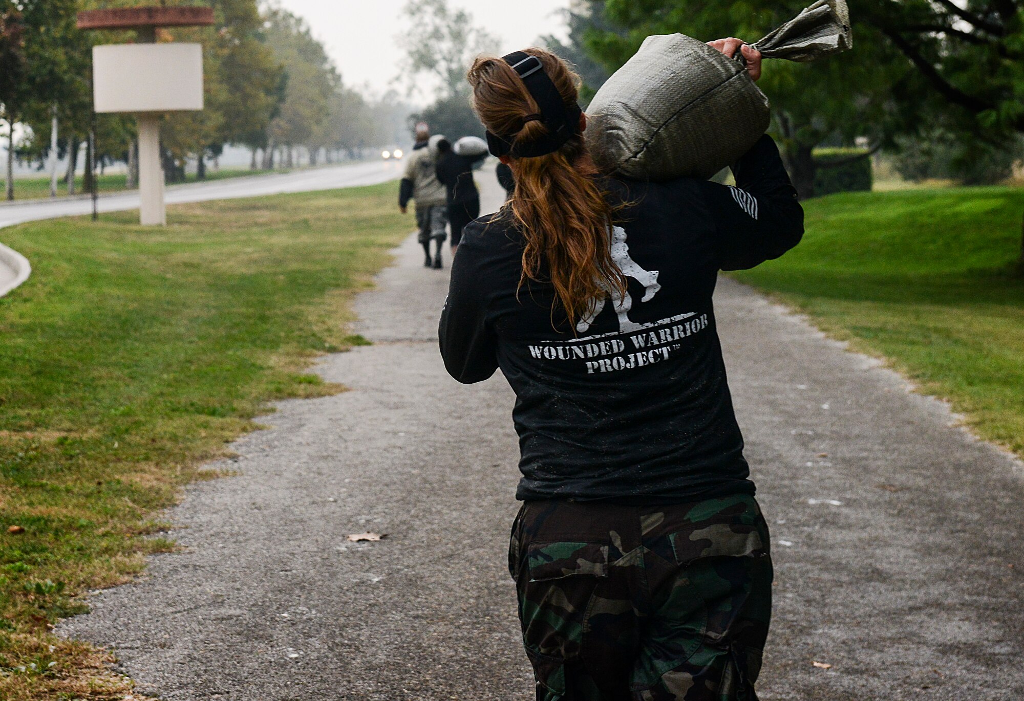 Senior Airman Amber Swearingen, 31st Fighter Wing, carried a sandbag during the 2nd Annual Tech. Sgt. Israel Del Toro Combat Run held Oct. 26 at Aviano Air Base, Italy. While the combat run highlighted Del Toro as a former member of the 8th Air Support Operation Squadron, it was also held to honor the sacrifices made by all wounded warriors. (U.S. Air Force photo by Senior Airman Katherine Tereyama)