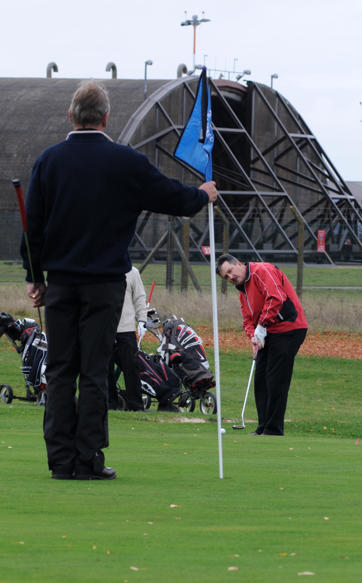 Master Sgt. Mark Littlejohn, 352nd Special Operations Maintenance Squadron maintenance operations center superintendent, representing the American team has a long putt at the first hole Oct. 26, 2012, during the British American Challenge Cup golf tournament held at Breckland Pines Golf Club, RAF Lakenheath, England. A Ryder Cup-style better-ball format was used for the matches.  (U.S. Air Force photo by Gary Rogers/Released)