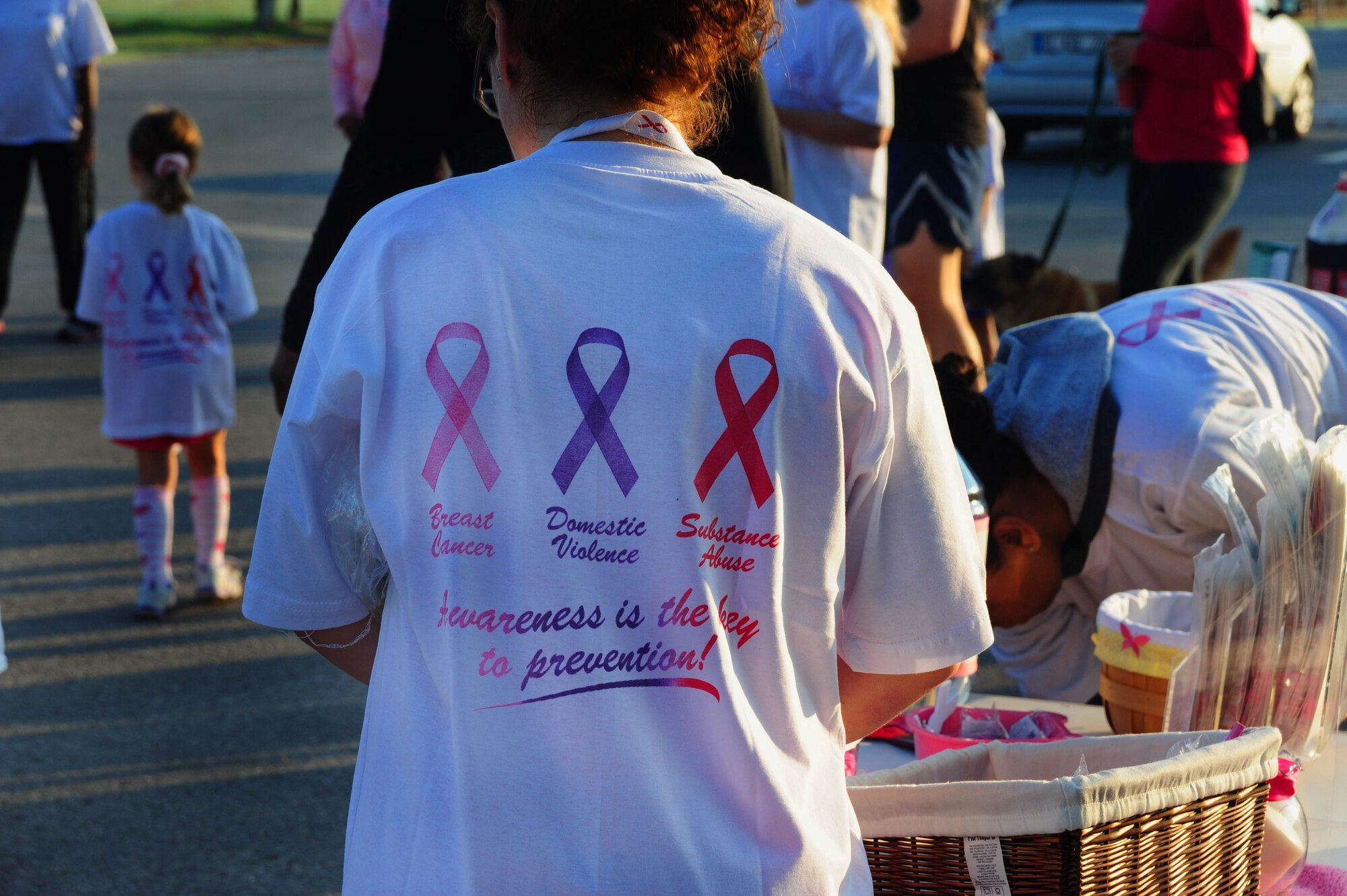 Airmen and family members sign up to participate in the Triple Ribbon 5k run Oct. 27, 2012, at Incirlik Air Base, Turkey. Donations for the charity run went to the Combined Federal Campaign in support of breast cancer, domestic violence and substance abuse awareness month. (U.S. Air Force photo by Senior Airman Anthony Sanchelli/Released)
