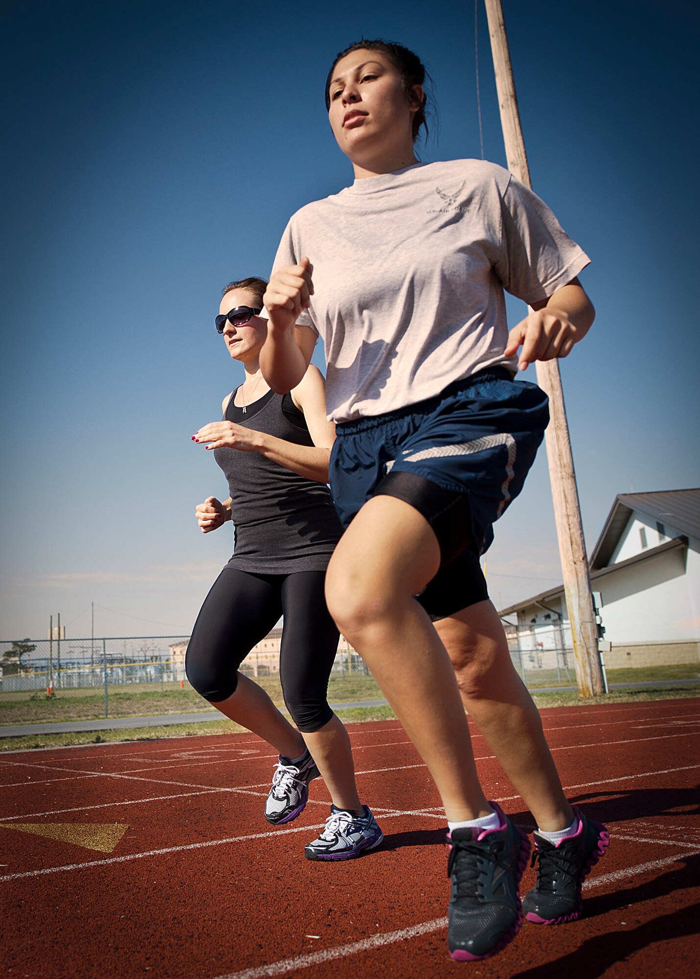 Airmen pace themselves during a track and field event at a 96th Mission Support Group sports day Oct. 26 at Eglin Air Force Base, Fla.  Eglin Airmen participated in ultimate football, track and field events, softball and golf.  The event helped raise money for the Combined Federal Campaign.  (U.S. Air Force photo/Randy Gon)