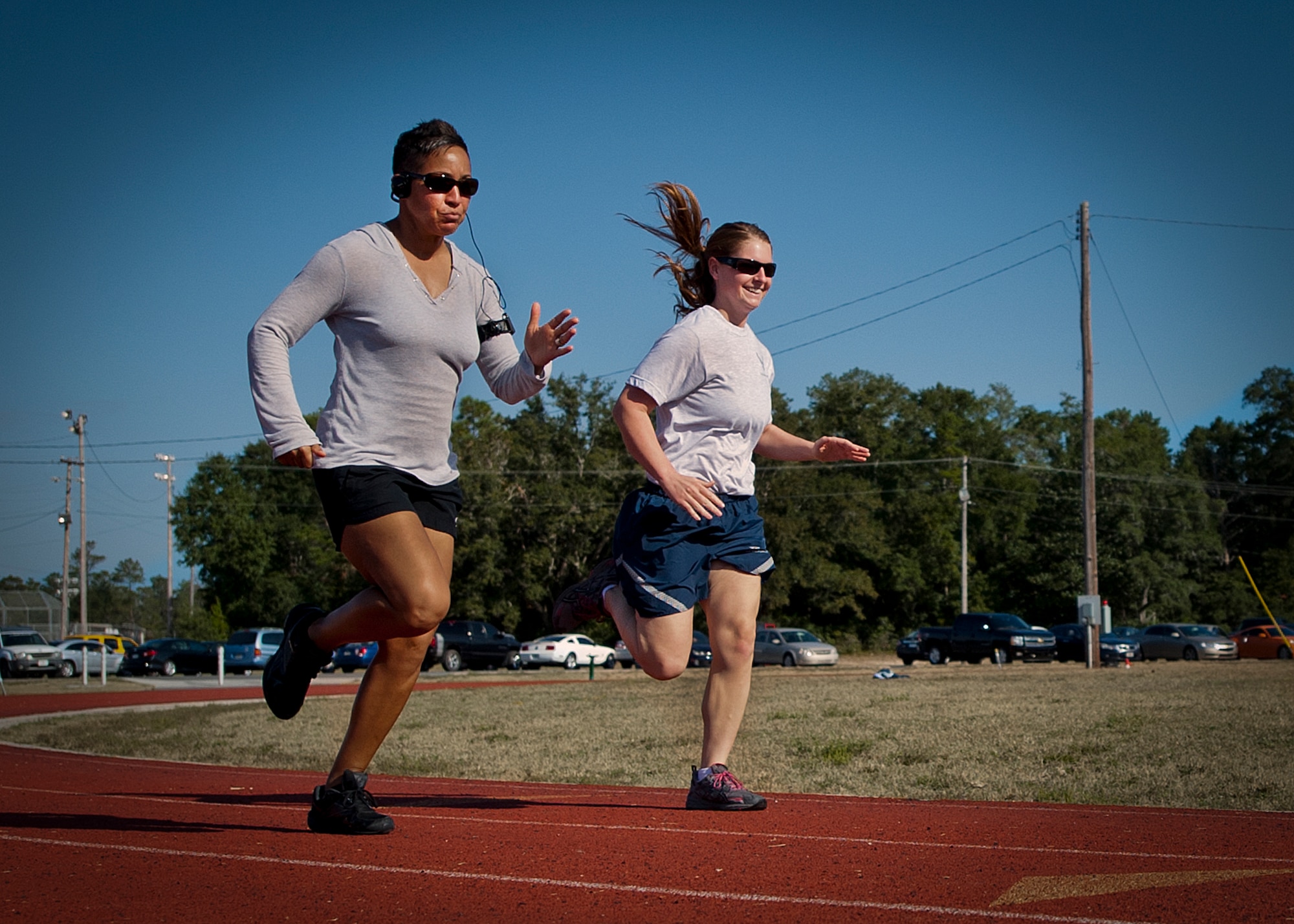 Airmen round the track during the 400-meter dash at a 96th Mission Support Group sports day Oct. 26 at Eglin Air Force Base, Fla.  Eglin Airmen participated in ultimate football, track and field events, softball and golf.  The event helped raise money for the Combined Federal Campaign.  (U.S. Air Force photo/Randy Gon)