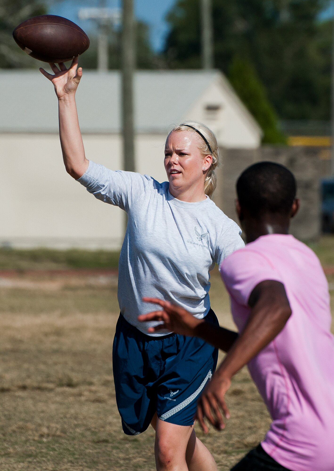 A 96th Logistics Readiness Squadron Airman passes to her teammate during a game of ultimate football at a 96th Mission Support Group sports day Oct. 26 at Eglin Air Force Base, Fla.  Eglin Airmen participated in ultimate football, track and field events, softball and golf.  The event helped raise money for the Combined Federal Campaign.  (U.S. Air Force photo/Samuel King Jr.)