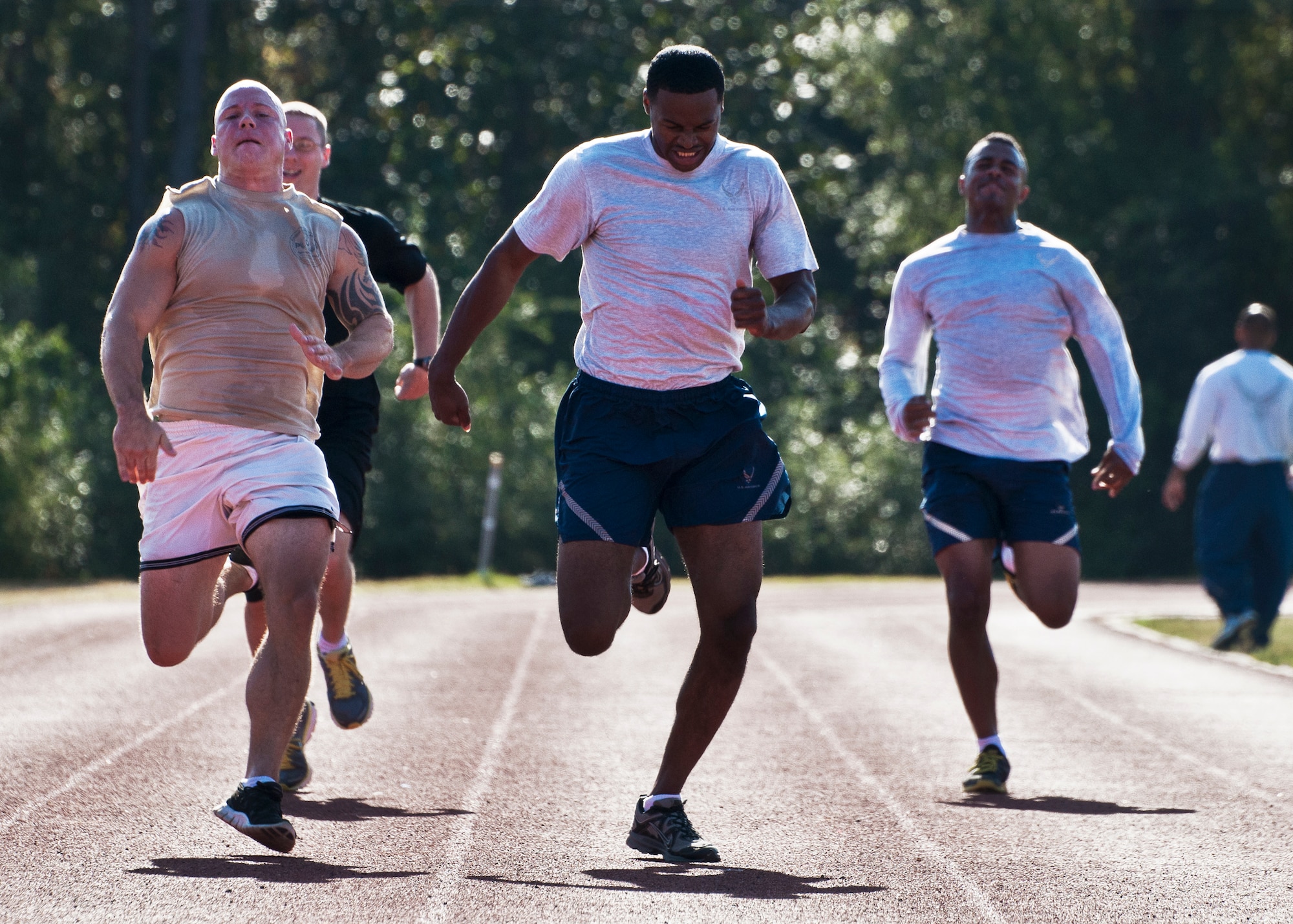 Airmen strive to be the fastest during the 100-meter dash at a 96th Mission Support Group sports day Oct. 26 at Eglin Air Force Base, Fla.  Eglin Airmen participated in ultimate football, track and field events, softball and golf.  The event helped raise money for the Combined Federal Campaign.  (U.S. Air Force photo/Samuel King Jr.)