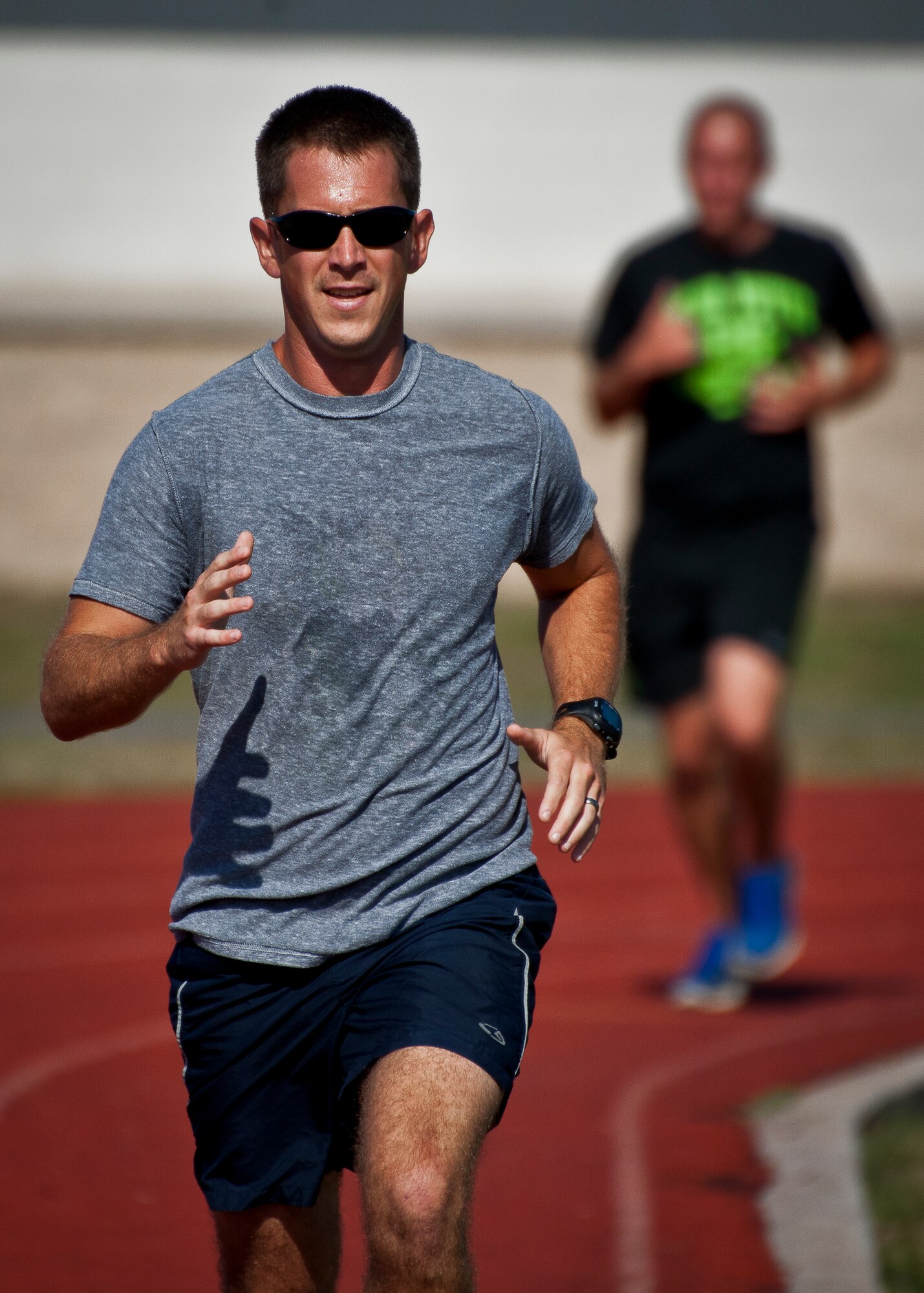 An Airman leads the way in the 1600-meter race at a 96th Mission Support Group sports day Oct. 26 at Eglin Air Force Base, Fla.  Eglin Airmen participated in ultimate football, track and field events, softball and golf.  The event helped raise money for the Combined Federal Campaign.  (U.S. Air Force photo/Samuel King Jr.)