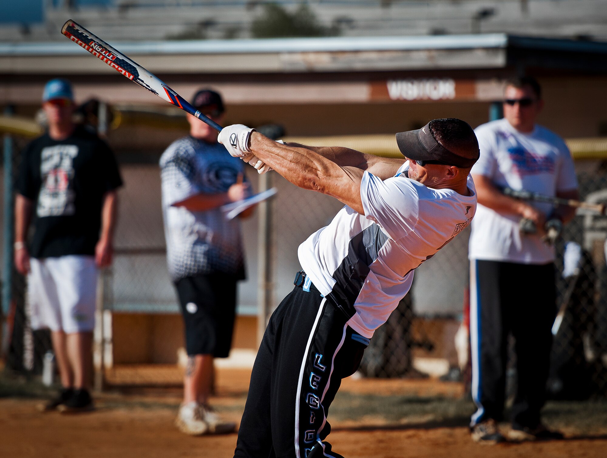 An Airman swings for the fences during a softball game at a 96th Mission Support Group sports day Oct. 26 at Eglin Air Force Base, Fla.  Eglin Airmen participated in ultimate football, track and field events, softball and golf.  The event helped raise money for the Combined Federal Campaign.  (U.S. Air Force photo/Samuel King Jr.)