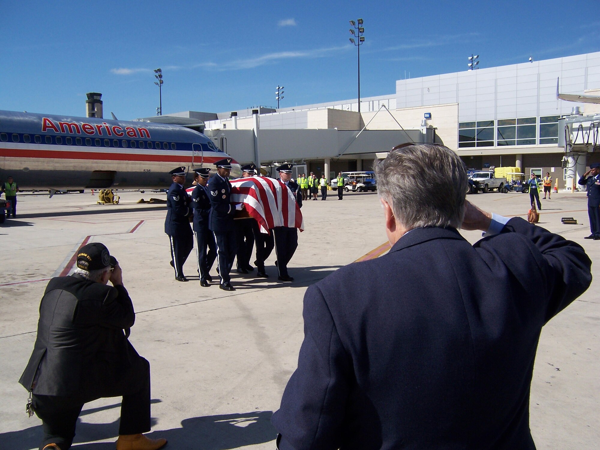 An Air Commando who died when his C-123 flare ship was shot down over Ahn Khe, Vietnam, was laid to rest Friday at Fort Sam Houston National Cemetery, Texas. Retired Senior Master Sgt. Gary Thomas and several of Airman 1st Class Jerry Mack Wall’s family members greeted the flag draped casket when it arrived to San Antonio Wednesday, aboard American Airlines Flight 497. Passengers on the plane watched from their windows as the fire department honored the flight with a water cannon salute and as the Joint Base San Antonio-Lackland Honor Guard carried Wall’s remains to an awaiting hearse. (Courtesy photo/Thomas)
