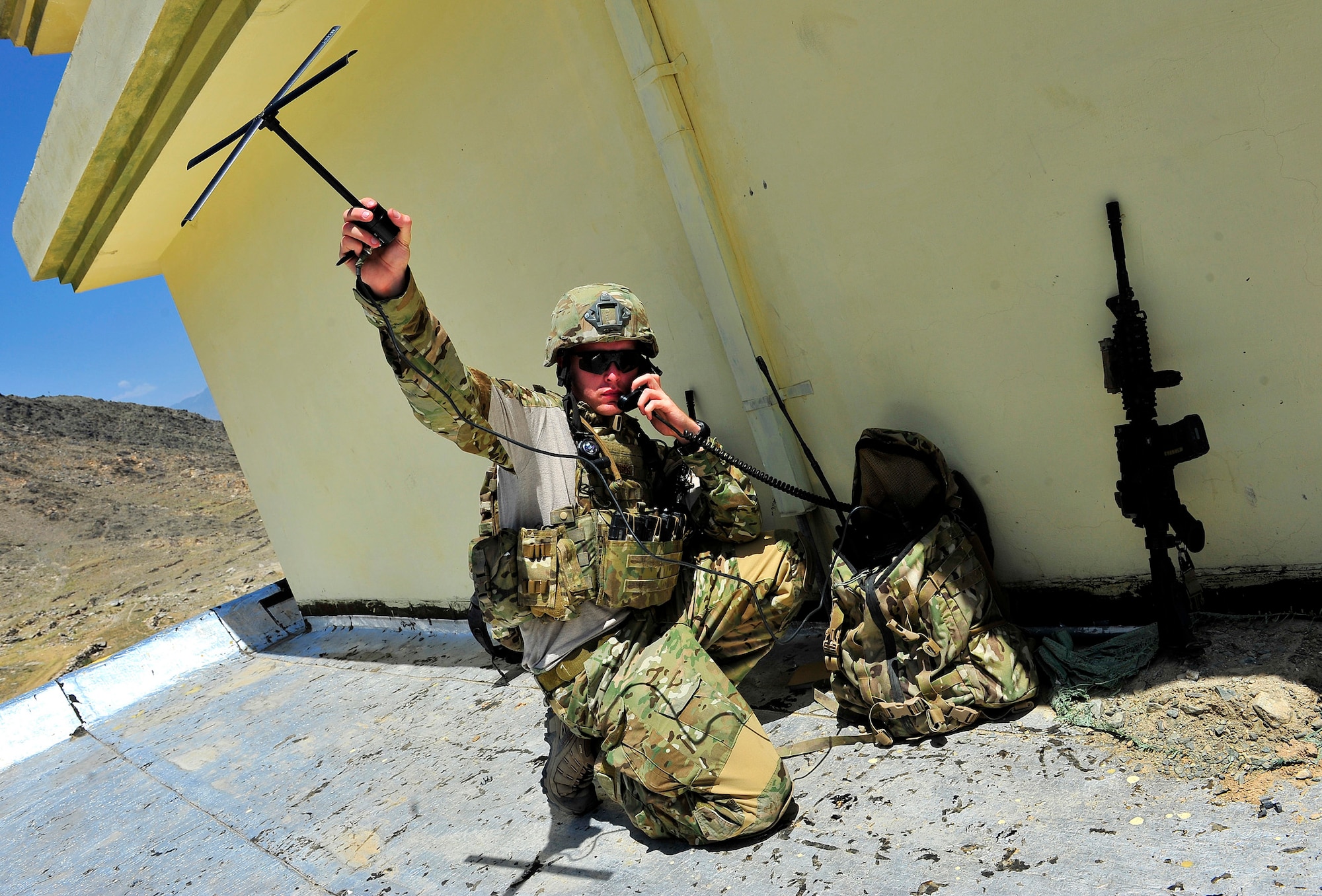 U.S. Air Force Airman 1st Class Joseph Farmer, Tactical Air Control Party member, 817th Expeditionary Air Support Operations Squadron, sets up ground communications with overhead aircraft during a mission in the Kunar Province of Afghanistan, July 3, 2012. Farmer is also a Radio Operation, Maintainer, and Driver who is currently in upgrade training to become a Joint Terminal Attack Controller. Farmer and other JTAC members provide ground forces with air superiority by controlling overhead aircraft that are able to deliver multiple weapons systems, as well as intelligence, surveillance, and reconnaissance capabilities. JTACs and ROMADs train and operate alongside their Army counterparts in order to prepare them for kinetic situations while outside-the-wire. (U.S. Air Force photo/Staff Sgt. Clay Lancaster)