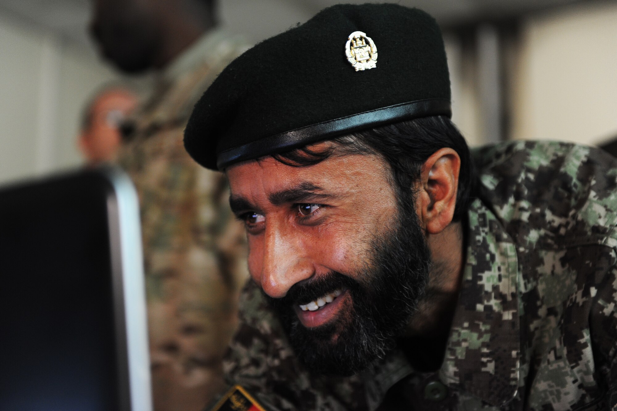 Afghan Air Force Lt. Abdul Ghafer volunteers to demonstrate what he has learned in class at the Kabul, Afghanistan, International Airport. Ahafer was one of 27 students to take part in computer classes taught by U.S. Air Force Master Sgt. Fred Anane, 438th Air Expeditionary Advisory Group Plans and Scheduling advisor and Master Sgt. Mark Jansen, 438th AEAG Quality Assurance advisor, for AAF schedulers, mission operations control center personnel and analyst soldiers. (Air Force photo by Staff Sgt. Melissa K. Mekpongsatorn) 
