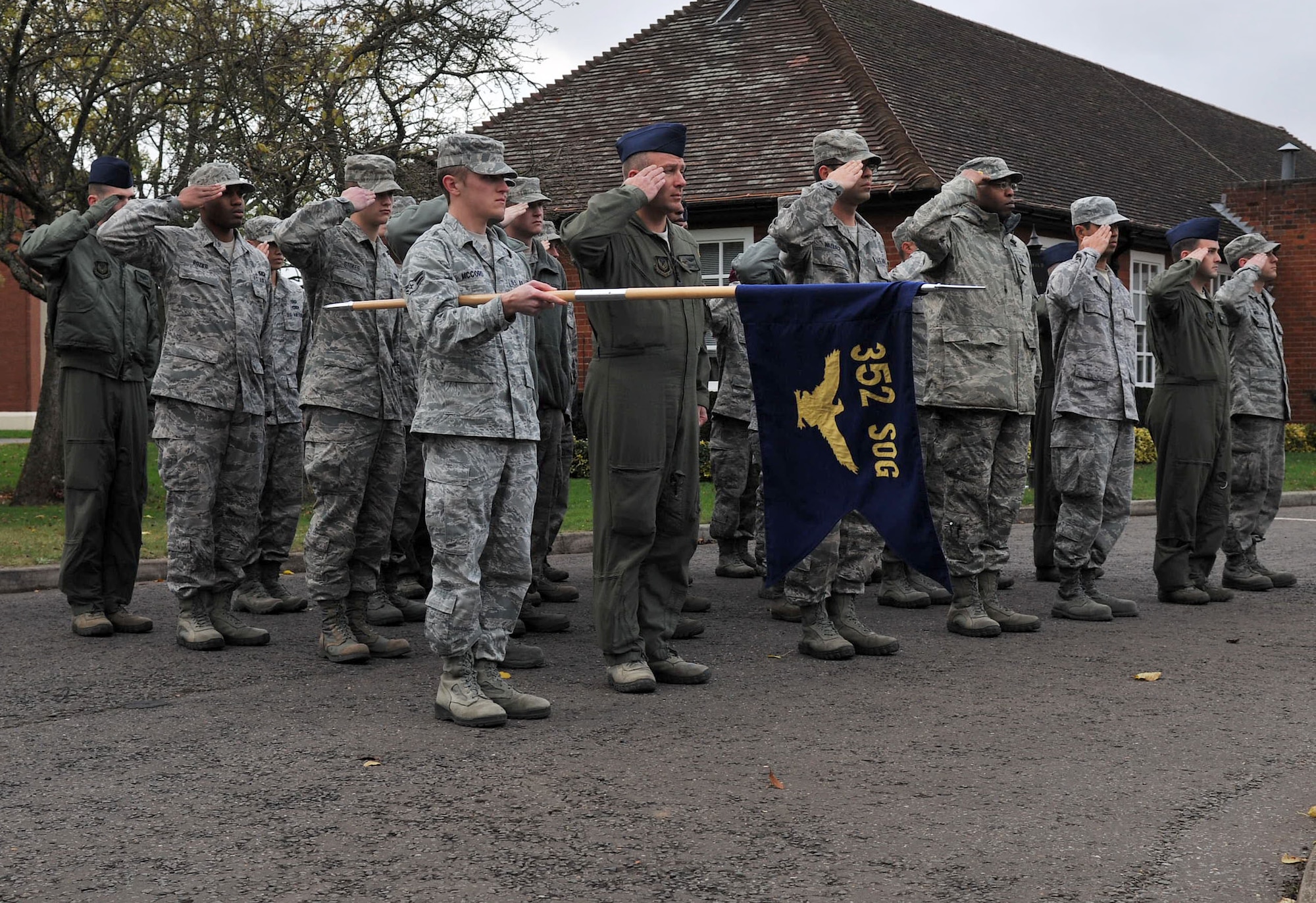 Airmen from the 352nd Special Operations Group salute the flag during a retreat ceremony Oct. 26, 2012, at RAF Mildenhall, England. One unit hosts a formal retreat ceremony on the last friday of each month. (U.S. Air Force photo by Senior Airman Jerilyn Quintanilla/Released)
