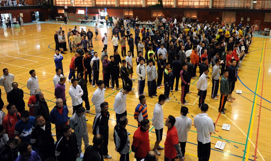 Competitors of the 11th Annual Northern Air Defense Force Commander’s Cup tug-of-war event stand in formation during opening remarks at Misawa Air Base, Japan, Oct. 27, 2012. Nineteen teams competed, but only one would stand out as the champion and receive the commander’s cup. The competition strengthened bonds between U.S. and Japanese forces and improved bilateral relations. (U.S. Air Force photo by Airman 1st Class Kia Atkins)