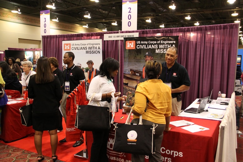 USACE Fort Worth District employees talk to students and attendees at the Career Fair during the Women of Color STEM Conference. Photo courtesy of Andre’ Mayeaux, USACE Fort Worth District.
