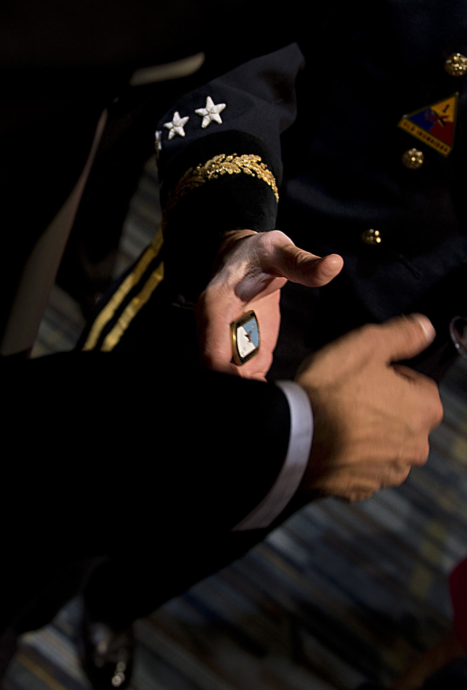 Army Gen. Martin E. Dempsey, chairman of the Joint Chiefs of Staff,  presents a signature coin