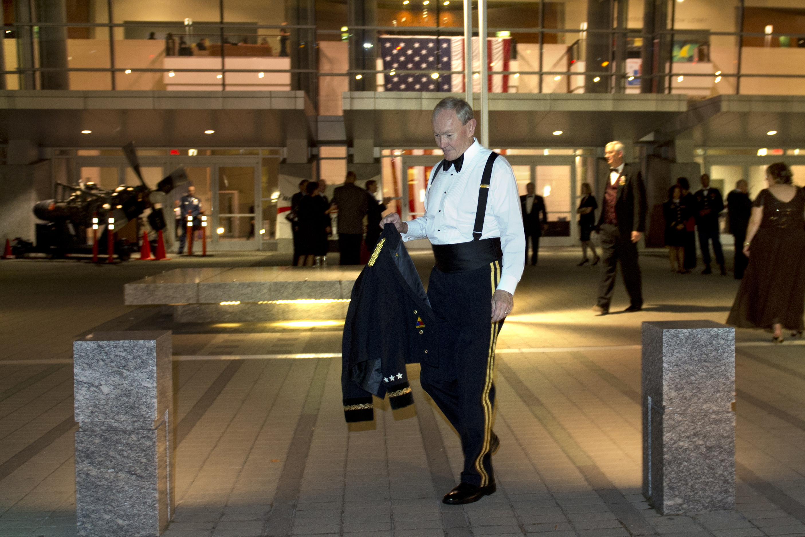 Army Gen. Martin E. Dempsey, chairman of the Joint Chiefs of Staff, exits  the USO of