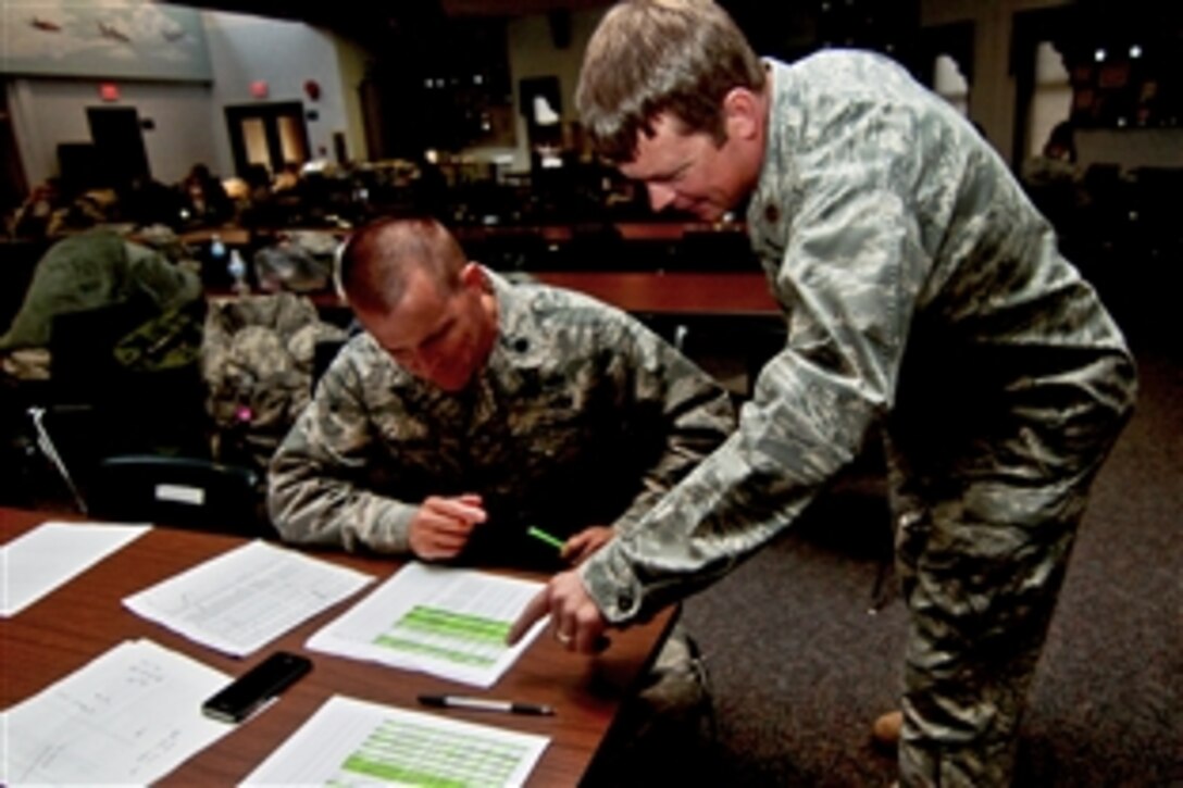 Airmen stand by at Atlantic City International Airport, N.J., Oct. 28, for orders to dispatch them to support operations during Hurricane Sandy. The airmen are assigned to the 177th Fighter Wing, New Jersey Air National Guard, which is located at the airport.