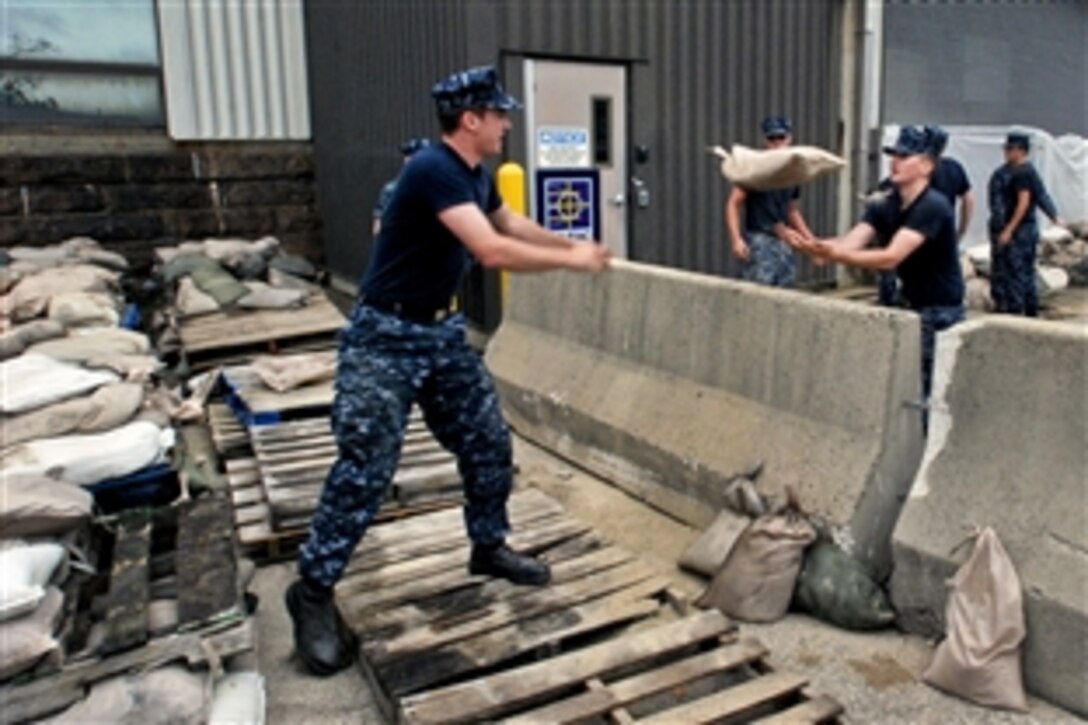 Sailors place sandbags around the power plant on Naval Submarine Base New London in Groton, Conn., to prepare for a storm surge from Hurricane Sandy, Oct. 28, 2012. The sailors are assigned to the Naval Submarine School. 