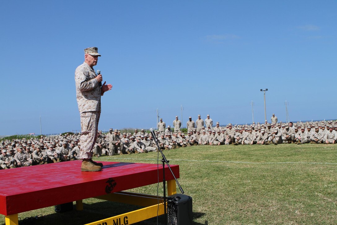 Lieutenant General Kenneth J. Glueck Jr. speaks to Marines and Sailors at a brief on Camp Kinser Oct. 25. During the brief Glueck spoke about local issues, the new liberty policy, sexual assault and hazing awareness and the commandant of the Marine Corps’ guidance. Glueck is the commanding general for III Marine Expeditionary Force and the Marines and Sailors are a part of 3rd Marine Logistics 
Group, III MEF. 