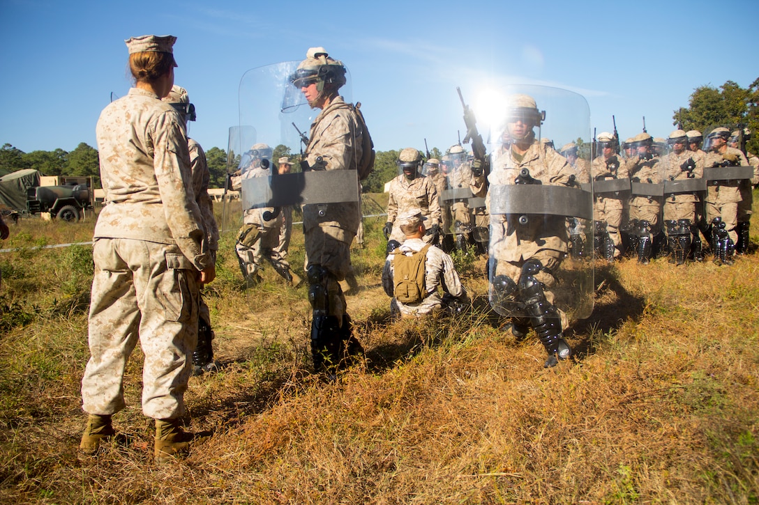 Marines of Combat Logistics Battalion (CLB) 26, instructed by Lance Cpl. Britney Thompson (left), military policeman from Wiley, Texas, learn the basics of nonlethal weapons training at Camp Lejeune, N.C., 24 Oct., 2012. CLB-26 is one of the three reinforcements of 26th Marine Expeditionary Unit, which is slated to deploy in 2013.