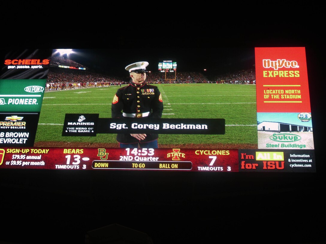 Sgt. Corey Beckman stands live on the field to be honored as "Hero of the Game" for the Iowa State and Baylor college football game. Beckman is the Supply Chief for Recruiting Station Des Moines and was the RS "A-Billet of the Year" for 2012.