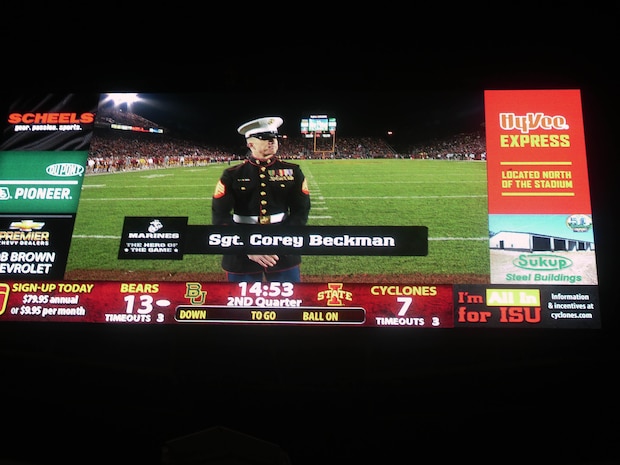 Sgt. Corey Beckman stands live on the field to be honored as "Hero of the Game" for the Iowa State and Baylor college football game. Beckman is the Supply Chief for Recruiting Station Des Moines and was the RS "A-Billet of the Year" for 2012.