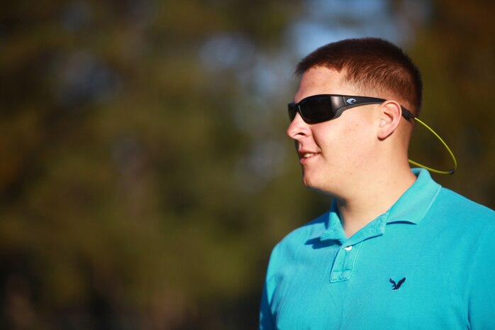 Lance Cpl. Benjamin W. Harrell, a participant in the Combat Logistics Regiment 27, 2nd Marine Logistics Group golf-tournament fundraiser, looks to the next field while his teammates finish putting their balls at the Paradise Point golf course aboard Camp Lejeune, N.C., Oct. 24, 2012. Marines and sailors took the day off to play golf and raise money for their Marine Corps Birthday Ball.