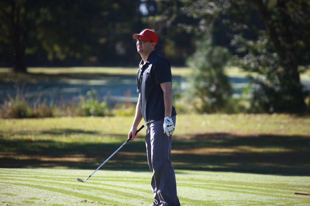 Navy Lt. Aaron G. Hassell, a dentist with the 2nd Dental Battalion, 2nd Marine Logistics Group, recovers after making a bad putt during a golf tournament held by Combat Logistics Regiment 27, 2nd MLG at Paradise Point golf course aboard Camp Lejeune, N.C., Oct. 24, 2012. The regiment organized the tournament as a fundraiser for its Marine Corps Birthday Ball and as a team-building exercise. 