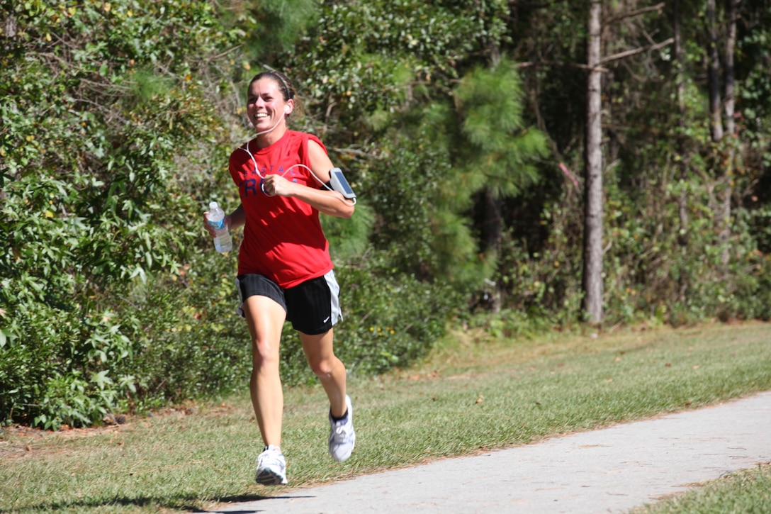 Participants race to the finish line during the Marine Corps Community Service Resilience Education’s Red Ribbon Week 5K Fun Run/Walk Oct. 22. Approximately 100 people ran and some wore red shirts to show their support. 