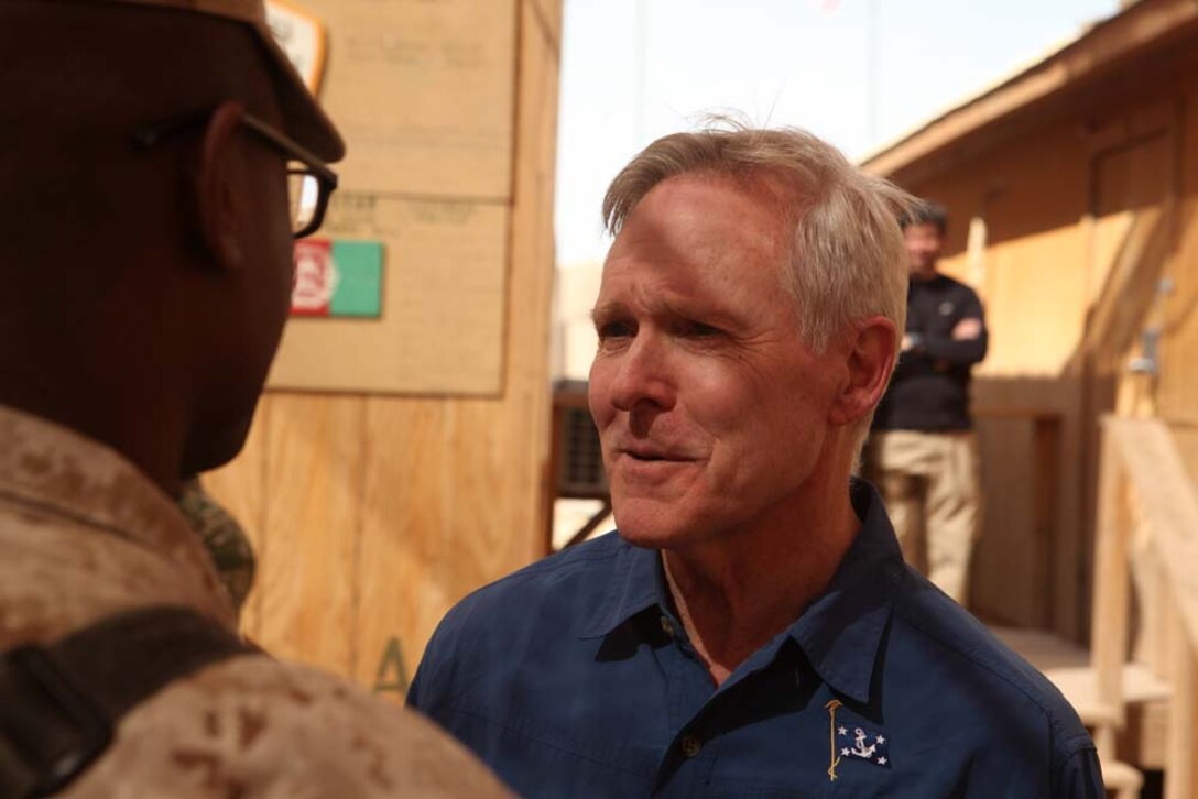Secretary of the Navy Ray Mabus speaks to a Marine at Forward Operating Base Geronimo, Afghanistan, Oct. 28. This was the secretary's 10th visit to Helmand province since he assumed his current position as the 75th Secretary of the Navy.