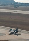 A Republic of Korea Air Force F-16 Fighting Falcon takes off while another with the 80th Fighter Squadron taxis during Max Thunder 12-2 on Kunsan Air Base, ROK, Oct. 30, 2012. The exercise is a chance for U.S. and ROK air forces to plan, execute and work side by side in various simulated scenarios to improve the capabilities and cohesion between the two. (U.S. Air Force photo/Staff Sgt. Jonathan Fowler)