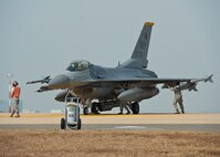 An F-16 Fighting Falcon with the 80th Fighter Squadron, is inspected prior to takeoff during exercise Max Thunder 12-2 on Kunsan Air Base, Republic of Korea, Oct. 29, 2012. Kunsan AB is hosting the ninth Max Thunder, a combined, large-force employment exercise which is designed to improve and demonstrate the capabilities of U.S. and ROK air forces. (U.S. Air Force photo/Staff Sgt. Jonathan Fowler)