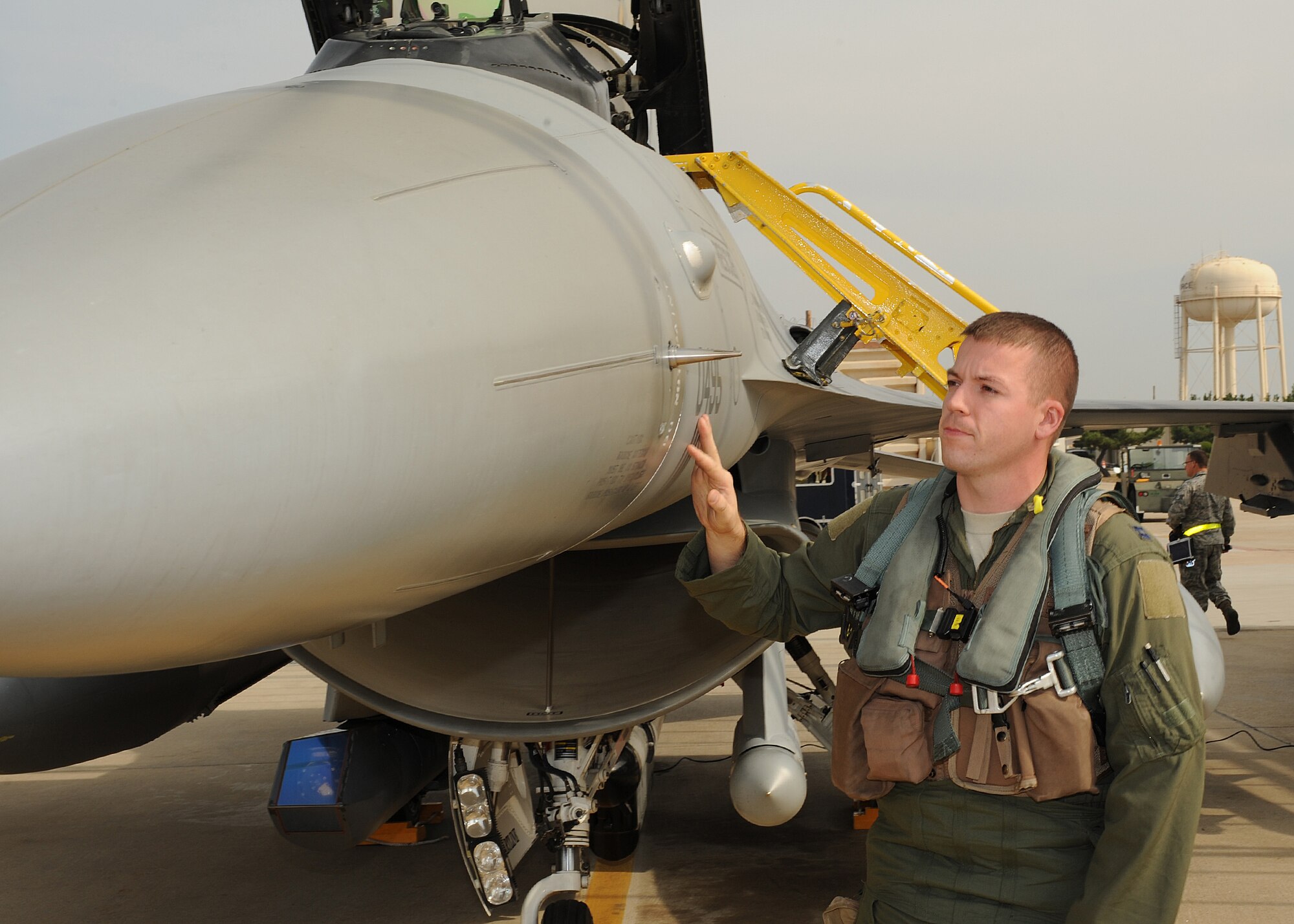 Capt. Alex Esson, with the 4th Expeditionary Fighter Squadron from Hill Air Force Base, Utah , performs a final inspection before takeoff during Max Thunder 12-2 on Kunsan Air Base, Republic of Korea, Oct. 29, 2012. Twelve  aircraft from Hill AFB deployed to Kunsan and are participating in Max Thunder . (U.S. Air Force photo/Staff Sgt. Jonathan Fowler)