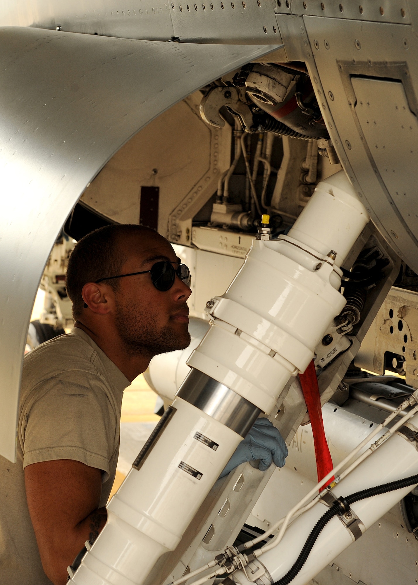 Senior Airman Antonio Williams, with the 4th Expeditionary Aircraft Maintenance Unit from Hill Air Force Base, Utah,  performs a preflight inspection on an F-16 Fighting Falcon during Max Thunder 12-2 on Kunsan Air Base, Republic of Korea, Oct. 29, 2012. Max Thunder is a combined, large-force employment exercise which includes numerous aircraft with the U.S. and ROK air forces. (U.S. Air Force photo/Staff Sgt. Jonathan Fowler)