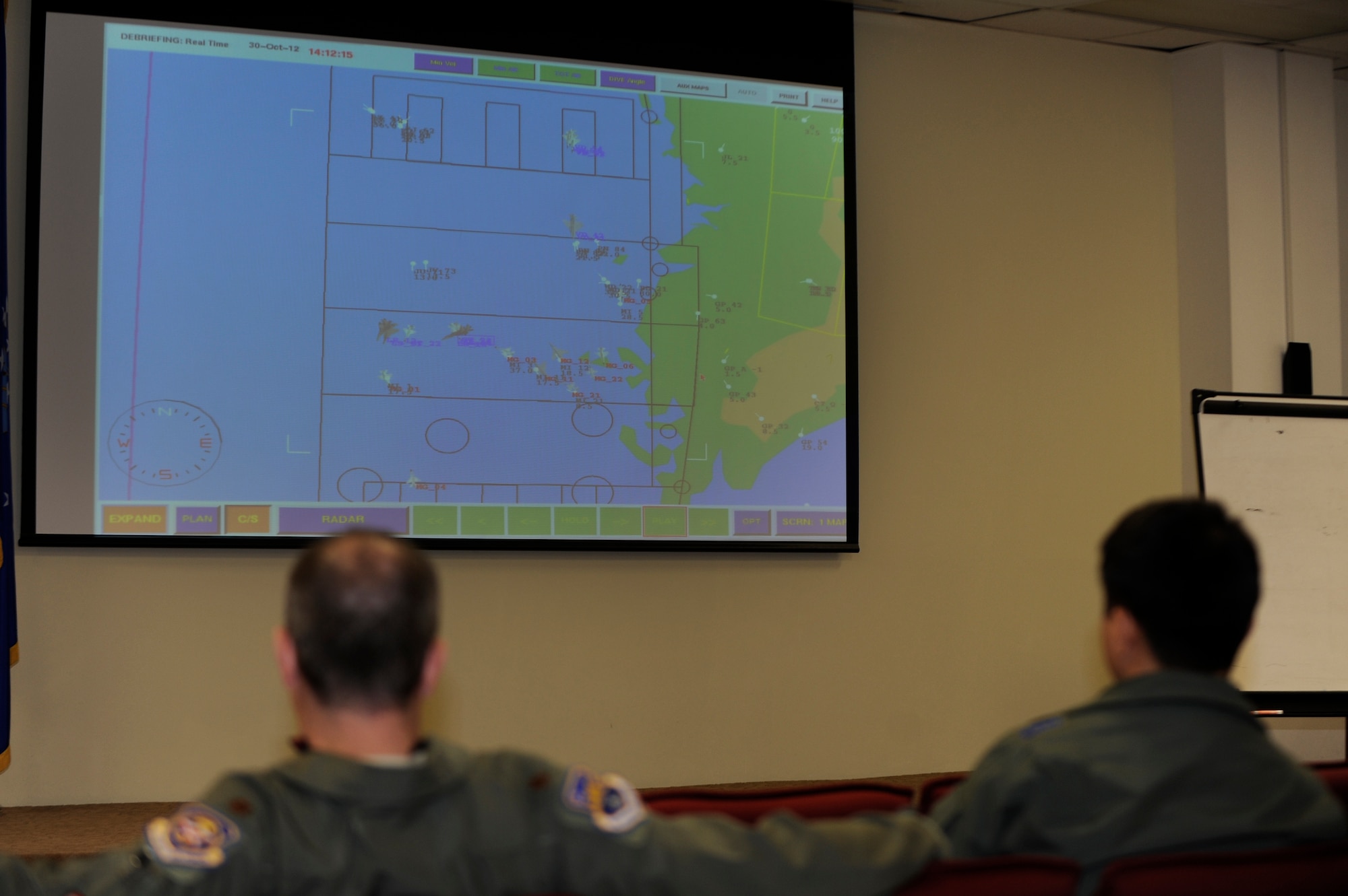 Members from the U.S. and Republic of Korea air forces watch a training scenario live during Max Thunder 12-2 at Kunsan Air Base, ROK, Oct. 30, 2012. The training provided an unparalleled planning opportunity between U.S. and ROKAF. (U.S. Air Force photo/Senior Airman Marcus Morris)