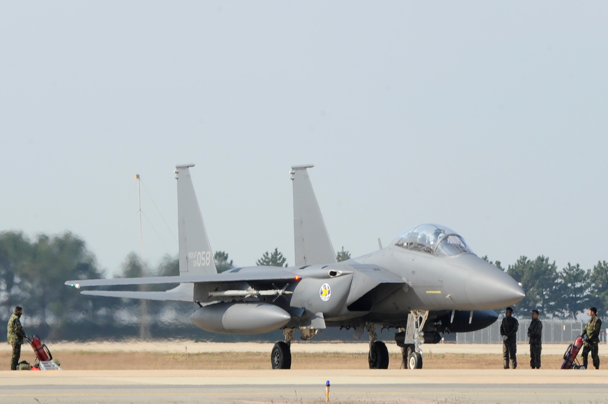 Members of Republic of Korea Air Force, 11th Fighter Wing prepare an F-15K Slam Eagle for take-off during Max Thunder 12-2 at Kunsan Air Base, Republic of Korea, Oct. 30, 2012. This is the ninth Max Thunder, a combined, large-force employment exercise designed to demonstrate and improve the capabilities of U.S. and ROKAF. (U.S. Air Force photo/Senior Airman Marcus Morris)