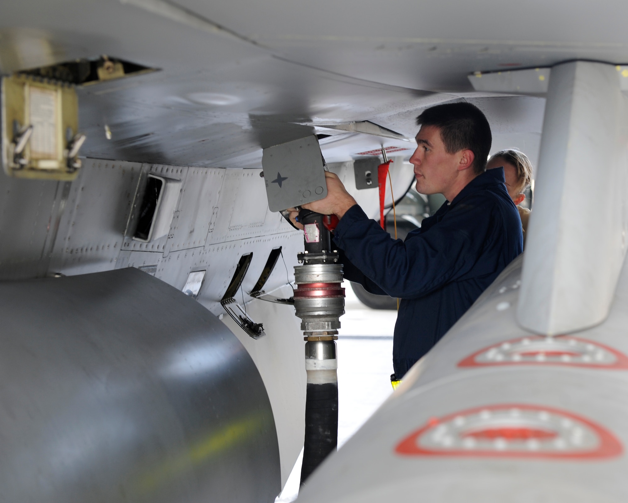 Senior Airman Joshua Gorman, 8th Aircraft Maintenance crew chief hooks a fuel truck to an F-16 Fighting Falcon during Max Thunder 12-2 at Kunsan Air Base, Republic of Korea, Oct. 30, 2012. The crew chief pumped 53 gallons of fuel into the jet allowing the pilots to continue participating in Max Thunder. (U.S. Air Force photo/Senior Airman Marcus Morris)