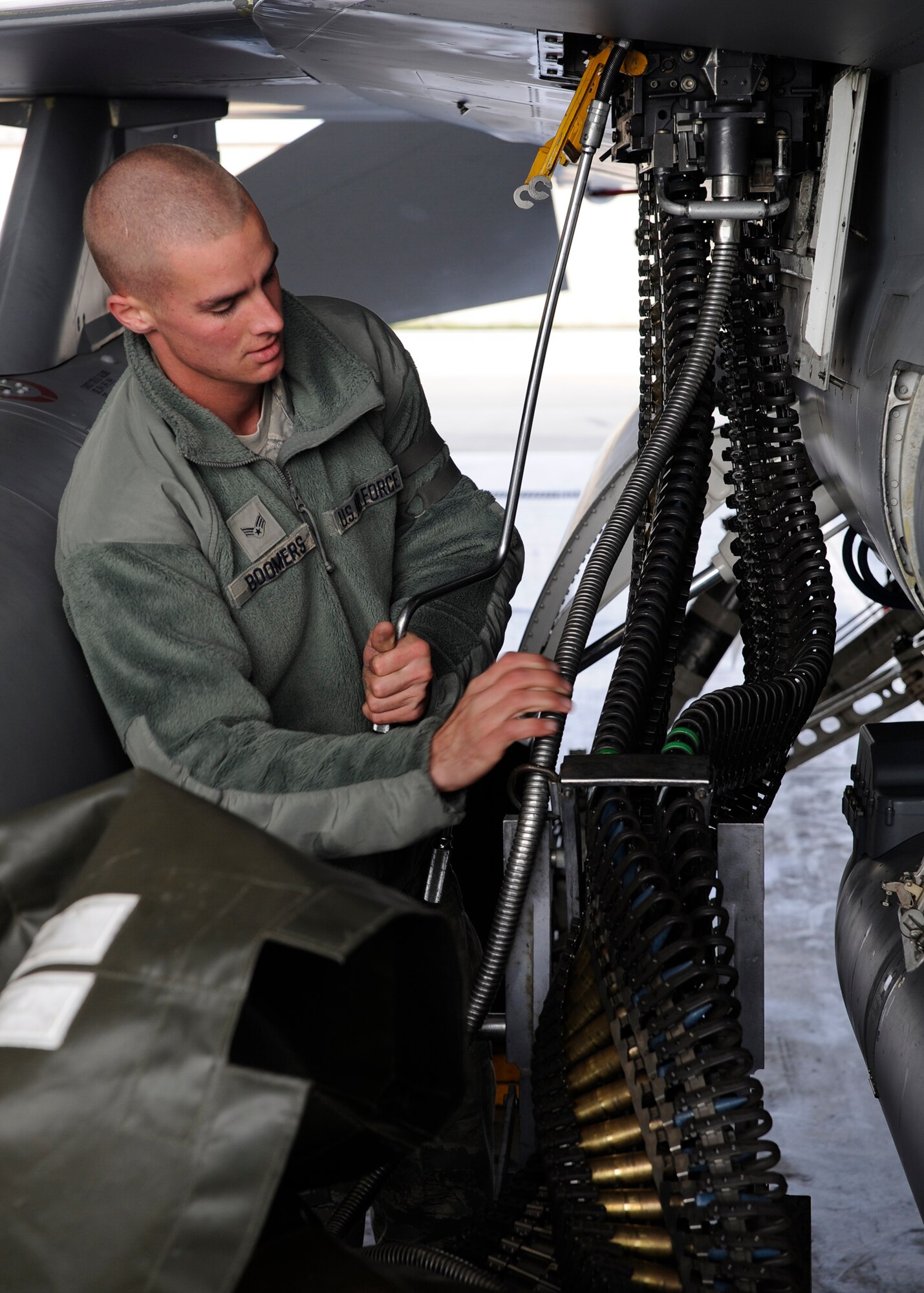 Senior Airman Jerry Boomers, 8th Aircraft Maintenance Squadron, loads dummy rounds into an F-16 Fighting Falcon during Max Thunder 12-2 at Kunsan Air Base, Republic of Korea, Oct. 30, 2012. The rounds allowed the pilots to simulate dog fights and train while keeping the pilots and the aircrafts safe. The training provides an unparalleled planning opportunity between U.S. and ROKAF. (U.S. Air Force photo/Senior Airman Marcus Morris)