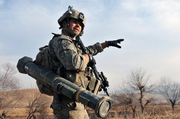 U.S. Army Sgt. Tyson Husk, a Scout with Bulldog Troop, White Platoon, 7th Squadron, 10th Cavalry Regiment, discusses a bounding movement with his platoon leader, U.S. Army 1st Lt. Nicholas Castello, while on a reconnaissance patrol near Combat Outpost Delorean, Bala Murghab, Badghis Province, Afghanistan Jan. 9, 2011. Husk hails from Jefferson, Ore., and was wounded in the calf on a patrol in late 2010. (U.S. Air Force photo/Master Sgt. Kevin Wallace/RELEASED)