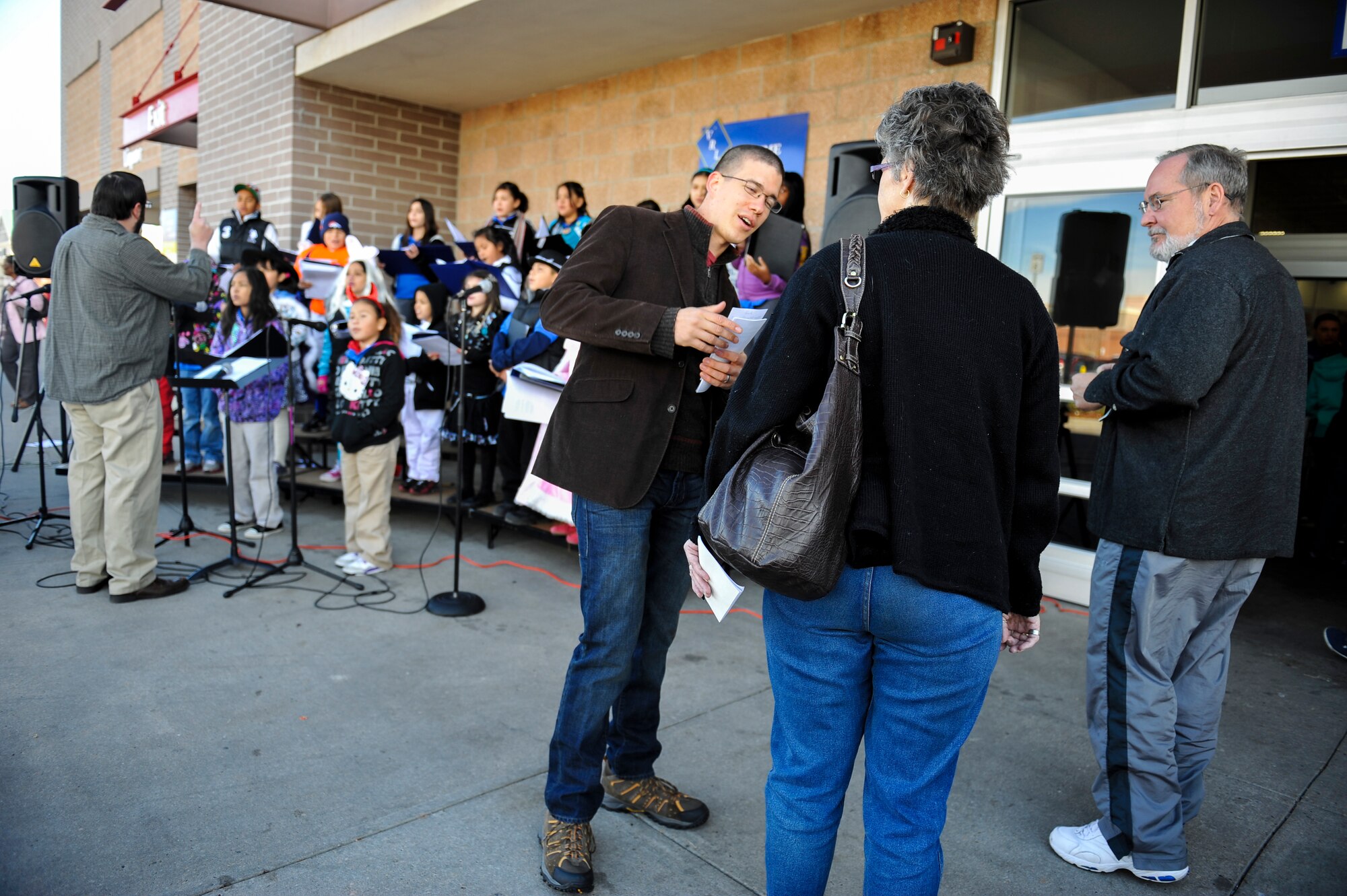 DENVER -- Airman 1st Class Darren Scott, 460th Space Wing Public Affairs broadcaster, speaks to customers about the Fill the Mayflower food drive Oct. 27, 2012, at a local grocery store. Junior enlisted service members in need will receive canned goods and monetary donations as part of Operation Warm Heart, a charter facilitated by the Buckley Air Force Base First Sergeants Council. (U.S. Air Force photo by Staff Sgt. Kathrine McDowell