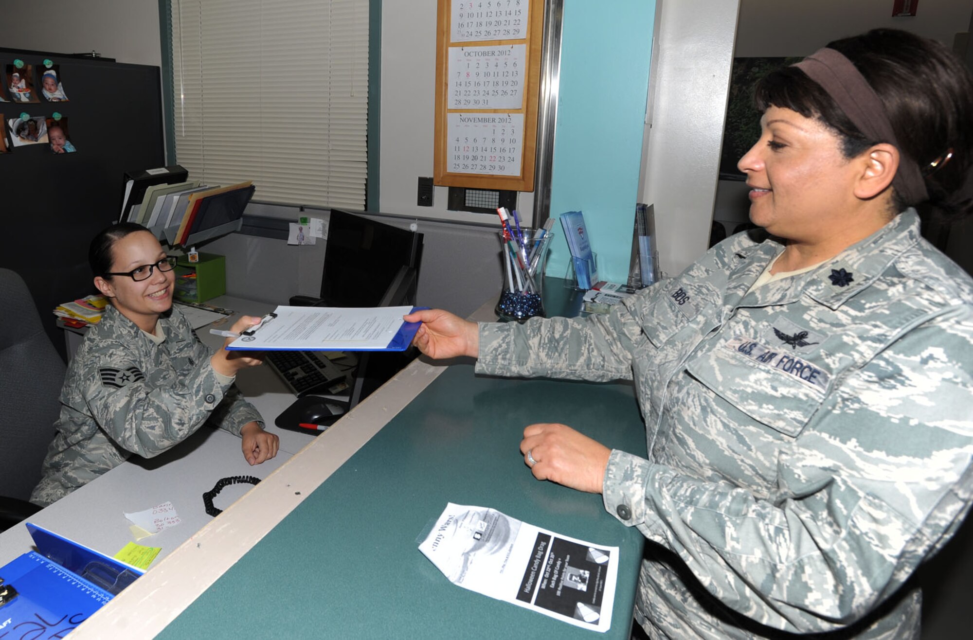 Staff Sgt. Amanda Gidaly, 22nd Aerospace Medicine Squadron dental assistant, checks in Lt. Col. Wendy Bos, 22nd Mission Support Group deputy commander, for an appointment Oct. 30, 2012, McConnell Air Force Base, Kan. Gidaly was chosen as spotlight performer for the week of Oct. 22 to 26. (U.S. Air Force photo/Senior Airman Laura L. Valentine) 