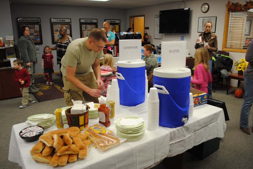 Guests enjoy a free warm meal during the 6th Annual Soup Supper, Oct. 25, 2012, at the Airman & Family Readiness Center on Grand Forks Air Force Base, N.D. About a dozen types of homemade soups were served at the event along with hotdogs, chips and freshly-prepared deserts. The event is designed to boost base morale and demonstrate appreciation for service members and their families. (U.S. Air Force photo/Senior Airman Luis Loza Gutierrez)