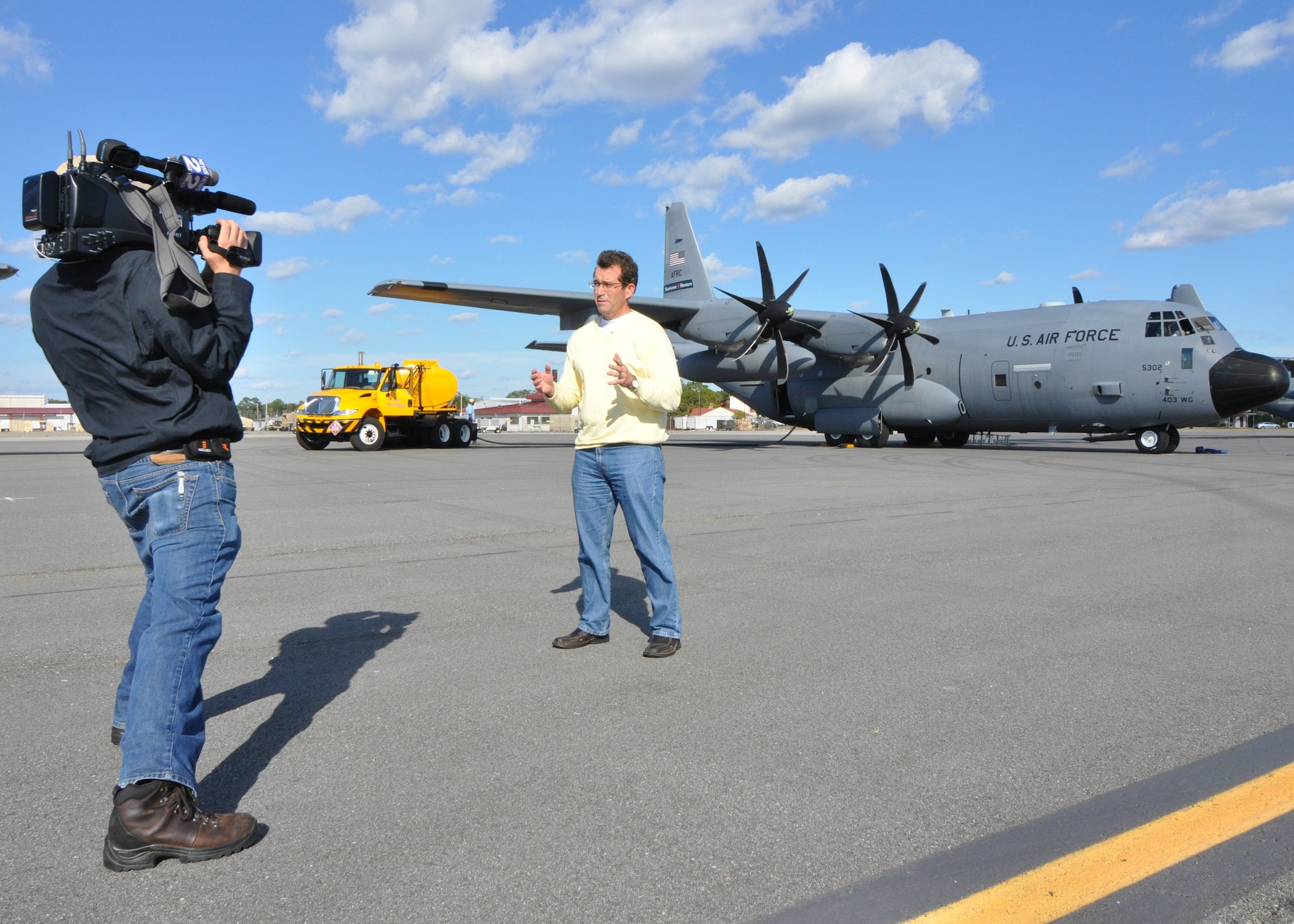 WCBD Chief Meteorologist Rob Fowler records a story on the flight line at Hunter Army Airfield, Ga. following a hurricane hunter mission flown into Hurricane Sandy Sunday. (U.S. Air Force photo / 1st Lt. Jeff Kelly)