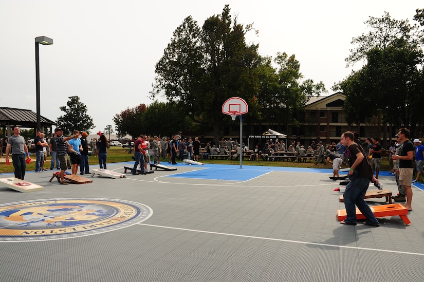 Airmen play corn hole at the 2012 Oktoberfest Oct. 26 at Joint Base Charleston - Air Base, S.C.,. Oktoberfest is an annual event put together by the First Six for ranks E-1 through E-6 to show appreciation for their day-to-day hard work. The event included free food and drinks, a disc jockey and a hot wing eating contest. Airmen also played games such as basketball and corn hole. (U.S. Air Force photo/ Airman 1st Class Chacarra Walker)