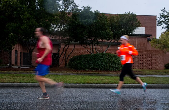 Participants run toward the finish line of the fourth annual Run the Runway 5K event honoring retired Brig. Gen. Thomas Mikolajcik Oct. 27, 2012, at Joint Base Charleston - Air Base, S.C. The 437th Airlift Wing hosted the event which was open to all military, Department of Defense civilians and the local community. (U.S. Air Force photo/ Airman 1st Class George Goslin) 
